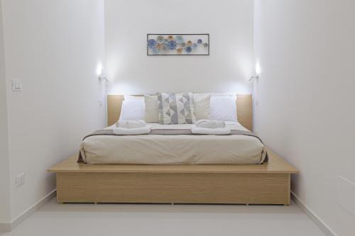 En eller flere senge i et værelse på Casa Ancora