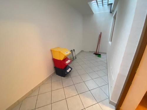 a room with a trash can in the corner of a room at Pradat in La Valle
