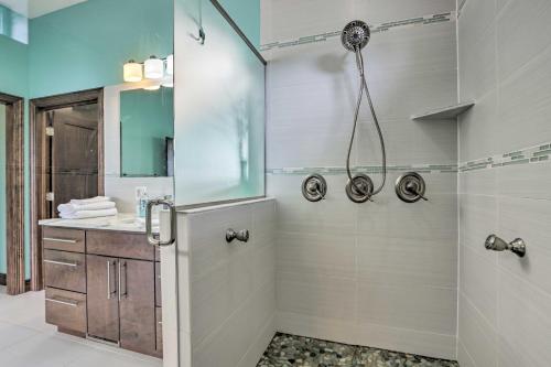 a bathroom with a shower with a glass door at Boat Dock and Kayaks Luxury Lake of the Ozarks Home in Kaiser