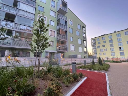 a building with a red carpet in front of it at The Seabreeze Apartment Turku in Turku