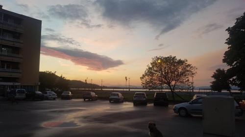 a parking lot with cars parked in a parking lot at Villa Bella in Golubac