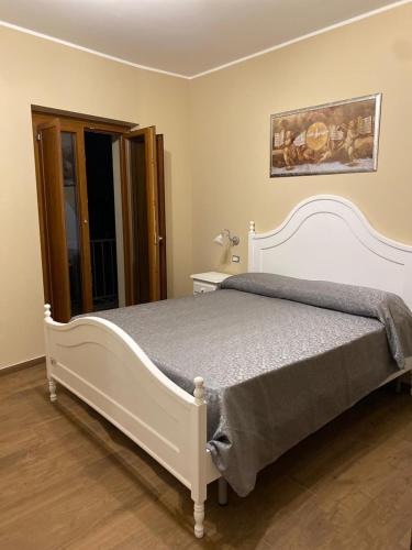 Postel nebo postele na pokoji v ubytování B&B NONNO MICHELE