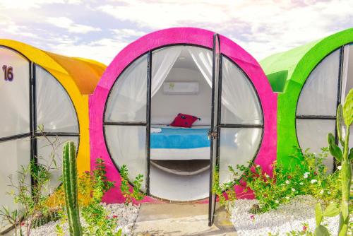 a group of three circular tents with a bed inside at Tubo Hotel La Tatacoa in Villavieja