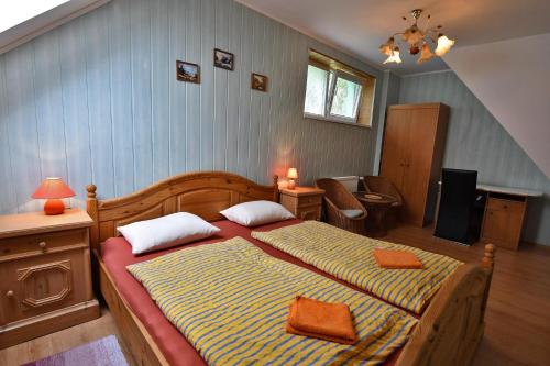 Posteľ alebo postele v izbe v ubytovaní APARTMENTS V+K