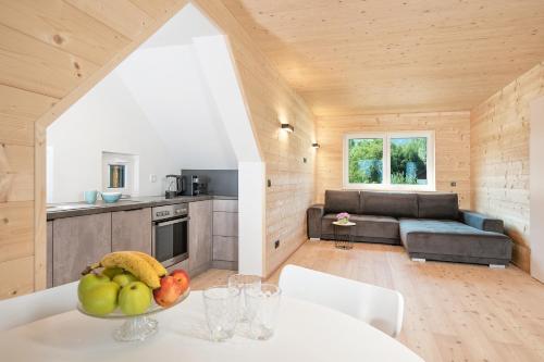 a kitchen and living room in a tiny house at Das Deutz in Oberaichwald