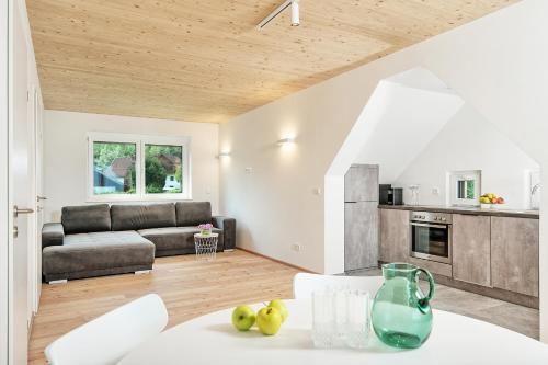 a living room with a couch and a table at Das Deutz in Oberaichwald