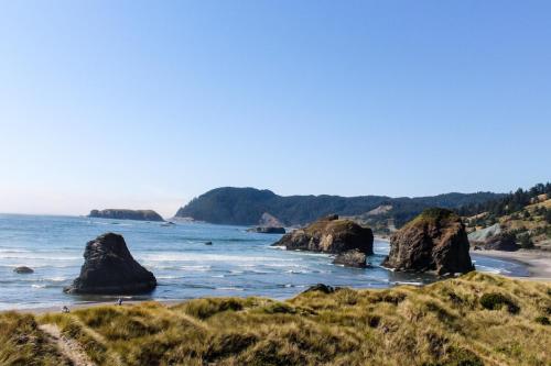 a beach with some rocks in the water at 2 Bed 1 Bath Vacation home in Gold Beach in Gold Beach