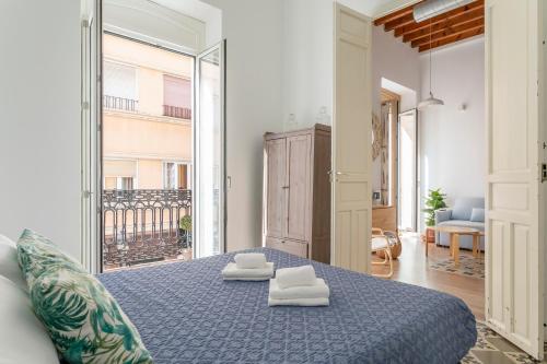 Posteľ alebo postele v izbe v ubytovaní Apartamentos Teatro Alicante