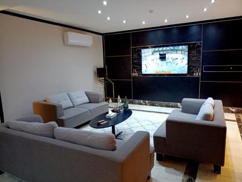TV a/nebo společenská místnost v ubytování RAK Al Jazeera Serviced Apartments