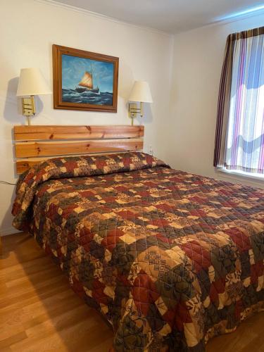 Ένα ή περισσότερα κρεβάτια σε δωμάτιο στο Oceanside Ocean Front Cabins