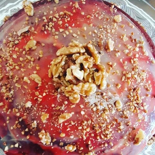 a cake with nuts on top of it on a plate at Hotel Costa Dalpiaz in Torres