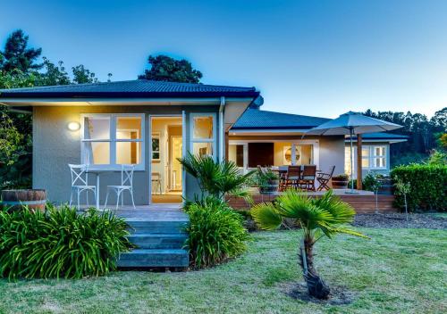 a small house with a porch and a patio at The Farmhouse in Napier