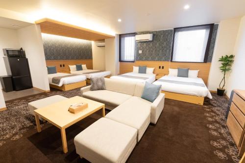 Postel nebo postele na pokoji v ubytování Chiyokura HOTEL SHUKU Nagoya