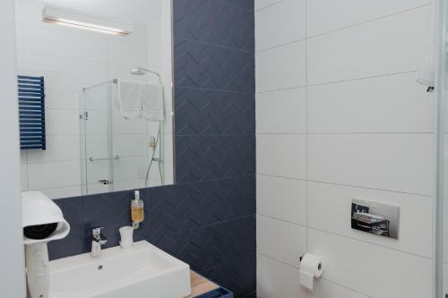 Ванная комната в Molto Bene Hotel & Restaurant