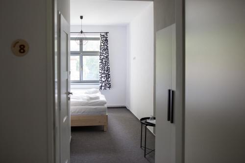 Een bed of bedden in een kamer bij Hotel Spálov