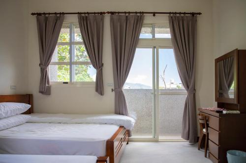 Postel nebo postele na pokoji v ubytování Tian Mama Homestay
