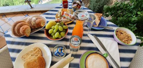 a picnic table with bread and other foods on it at Le Perle d'Italia in Ravello