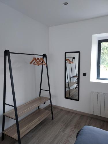 a room with a ladder and a mirror at Céline et corentin in Pordic