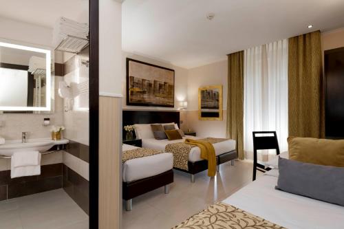 Postel nebo postele na pokoji v ubytování Yes Hotel Boutique Rome