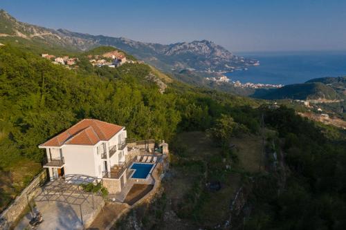 an aerial view of a house with a swimming pool at Villa Tranquila in Budva