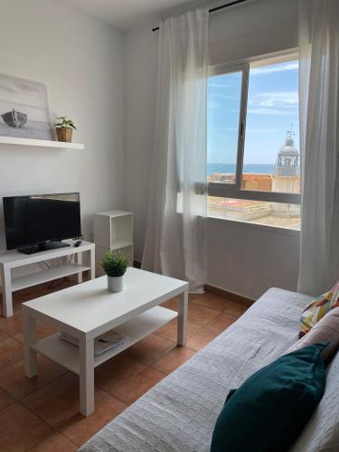TV in/ali zabaviščno središče v nastanitvi Apartamento y Piso frente al mar con vistas en Garrucha