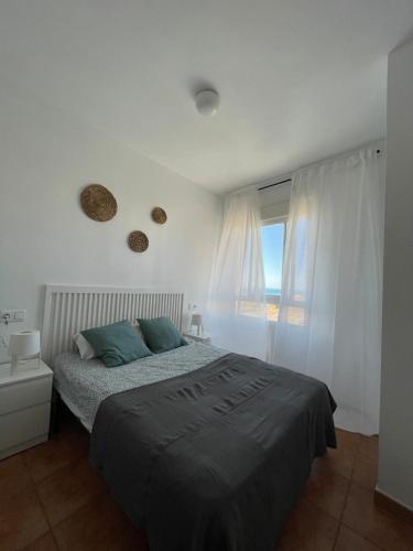 Ένα ή περισσότερα κρεβάτια σε δωμάτιο στο Apartamento y Piso frente al mar con vistas en Garrucha