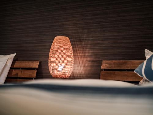 a lamp sitting on top of a table at ザ・ビーチテラスホテルアオ石垣 in Ishigaki Island