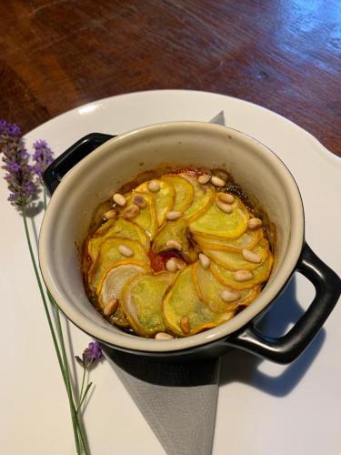a pot of food sitting on a table at Manoir de Malagorse in Cuzance