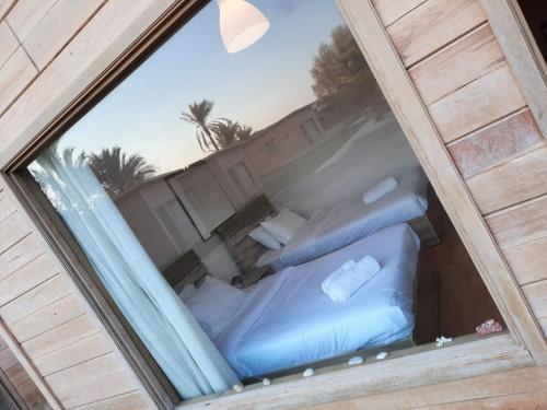 a view of two beds in a room at The Mansion El Gouna in Hurghada