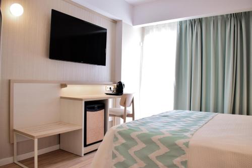 Una cama o camas en una habitación de Ambassador Playa I