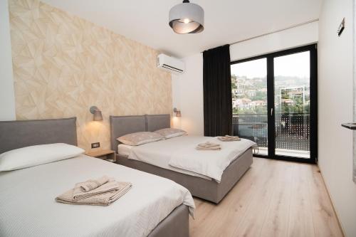 Postel nebo postele na pokoji v ubytování Apartments Marea