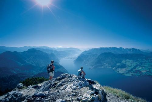 two people standing on top of a mountain at Landhotel Grünberg am See in Gmunden