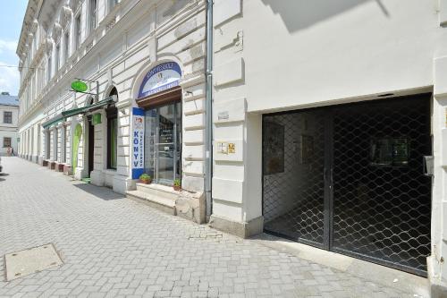 an empty street in front of a building at NETTA APARTMAN in Eger