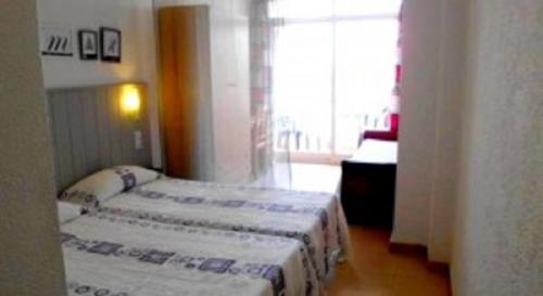 Cama o camas de una habitación en Hostal La Barraca