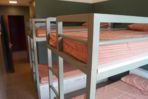 a group of bunk beds in a room at Alberg Los Josepets in Les Cases d'Alcanar