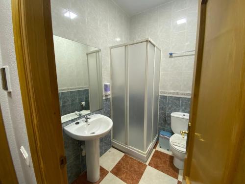 a bathroom with a sink and a toilet at Fonda Chiquito in Alhama de Almería