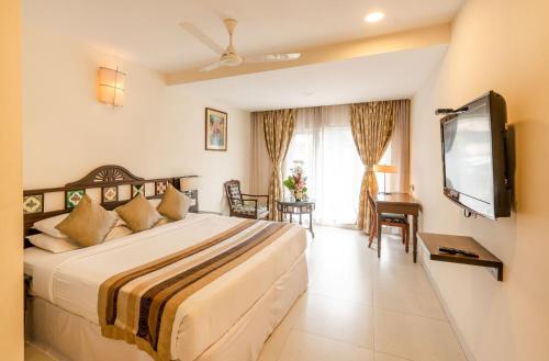 En eller flere senge i et værelse på La-Paz Gardens Beacon Hotel - Vasco da Gama Goa