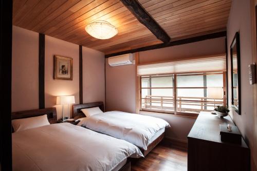 Postelja oz. postelje v sobi nastanitve Kiyomizu Machiya Inn