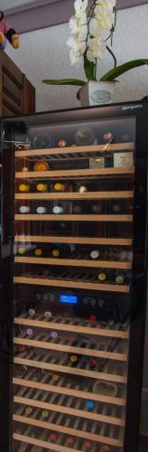 a wine rack filled with lots of wine bottles at Hotel Garni am Eckernweg in Celle