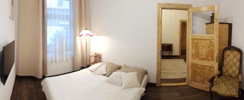 Posteľ alebo postele v izbe v ubytovaní Apartament Krupówki