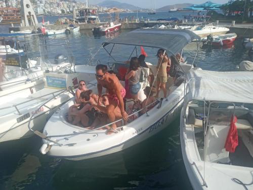 a group of people on a boat in the water at Saranda Backpackers in Sarandë