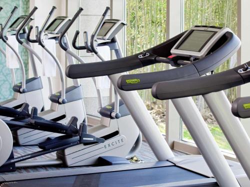 a row of exercise bikes in a gym at Fairmont Yangcheng Lake in Kunshan