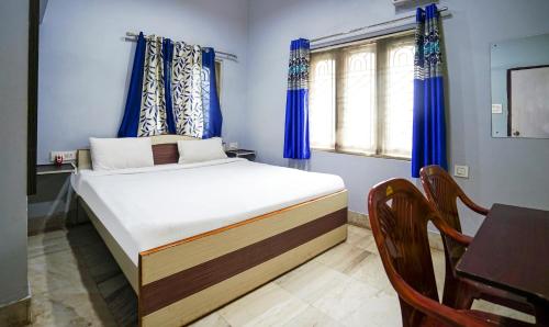Postel nebo postele na pokoji v ubytování Ratna Resort near Bhubaneswar Airport