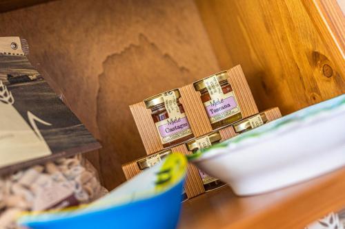 a close up of a counter with a bowl of food at Hotel Palazzuolo in San Quirico dʼOrcia