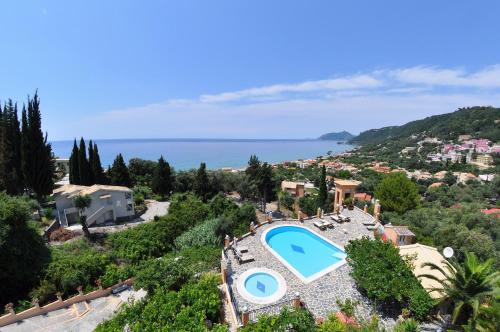 an aerial view of a villa with a swimming pool at Dina's Paradise in Agios Gordios