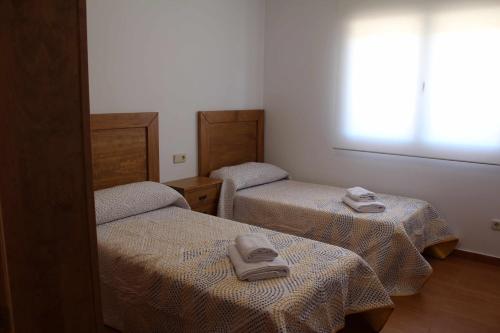 Llit o llits en una habitació de Casa Rural La Sureña 2