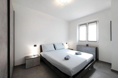 Кровать или кровати в номере Appartamento 8 Il Tornante