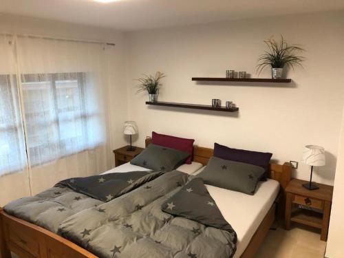 Postel nebo postele na pokoji v ubytování Ferienwohnung Weibhauser