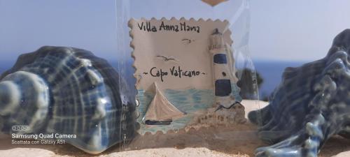 a sandcastle with a lighthouse and a ship at Villa Anna Maria in Capo Vaticano