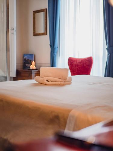 Postel nebo postele na pokoji v ubytování Palazzo dei Pavoni, Relais di Charme